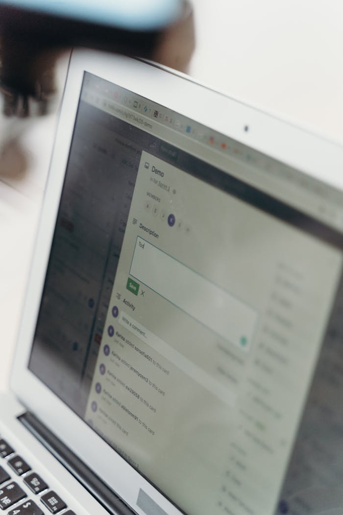 why-choose-us Close-up of a laptop screen showing a web interface for data input and analysis.
